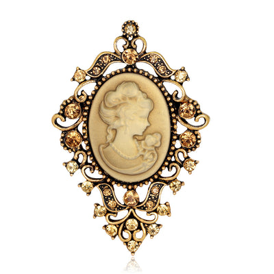 Front product view of the woman portrait brooch pin in gold and black
