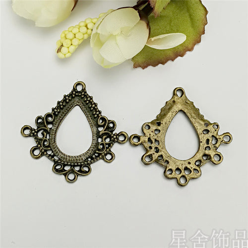 Close product view showing the ornate teardrop earring blank details