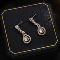 Elegant Silver Needle Rhinestone Oval Studs With Hollow Teardrop Crystal Pendant Luxury Earrings view 3