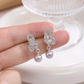 Elegant Hollow Butterfly Rhinestone Zircon Alloy Stud Earrings With Grey Faux Pearl Drop Luxury Earrings view 3