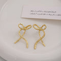 Elegant Korean Minimalist Alloy Metal Ribbon Bow Stud Earrings For Women Niche Design Wire Bowknot Earrings view 4