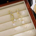 Elegant Luxury Korean Style Gold Alloy Curved Line Rhinestone Zircon Pearl Drop Dangle Earrings view 1