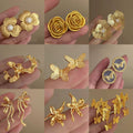 Gold Plated Iron Floral Butterfly Pearl Stud Earrings With Silver Pins, Chic Vintage Statement Design view 1