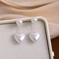 Elegant Two Way Pearl Heart Drop Stud For Women With Round Faux Pearl And Gold Alloy Chain Earrings view 1