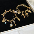 Fresh Ocean Pearl Alloy Bangle With Goldfish Conch And Starfish Summer Vacation Style view 1