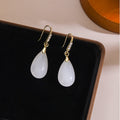 Vintage Chinese Style Luxury Rhinestone Inlaid Gold Alloy White Teardrop Dangle Qipao Earrings view 3