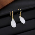 Vintage Chinese Style Luxury Rhinestone Inlaid Gold Alloy White Teardrop Dangle Qipao Earrings view 4