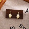 Elegant Vintage Milk White Oval Acrylic Bead Gold Alloy Geometric Drop Stud Earrings view 1