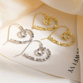 Korean Light Luxury Alloy Hollow Heart Spiral Hoop Earrings For Women Minimalist Faceted Ripple Earrings view 1