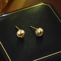 Elegant Matte Gold Alloy Twisted Knot Studs For Women Luxury Minimalist Small Wrap Design Earrings view 1