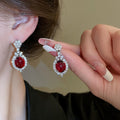 Copper Red Rhinestone Oval Flower Stud Earrings With Silver Pins Light Luxury European Style view 1