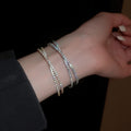 French Minimalist Pave Zircon Cross Open Copper Bangle With Circle Detail view 1