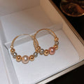 Light Luxury Faux Pearl Ball Twist Texture Geometric Hoop Earrings For Women view 2