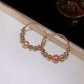 Light Luxury Faux Pearl Ball Twist Texture Geometric Hoop Earrings For Women view 4