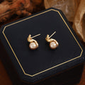 French Vintage Cross Champagne Pearl Alloy Studs Elegant Light Luxury Women's Fashion Earrings view 2