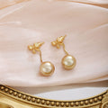 Elegant Two Way Gold Alloy Bowknot Studs With Champagne Pearl Drop For Women Luxury Fashion Earrings view 3