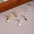 Elegant Alloy Bow Knot Studs With Shiny Sequin Disc Tassel Pendant For Women Fashion Earrings view 1