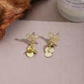 Elegant Alloy Bow Knot Studs With Shiny Sequin Disc Tassel Pendant For Women Fashion Earrings view 4