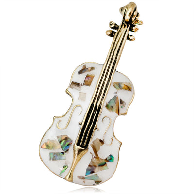 Front product view of the shell brooch pin in gold and silver