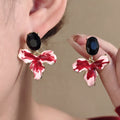 Luxury Contrast Red Enamel Flower Petal Dangle With Black Crystal Studs And Gold Alloy Trim Earrings view 1