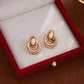 Luxury Gold Alloy Double Hoop Twisted Ring Drop Earrings For Women Elegant Statement Metal Earrings view 2