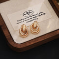 Luxury Gold Alloy Double Hoop Twisted Ring Drop Earrings For Women Elegant Statement Metal Earrings view 1
