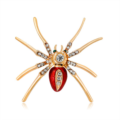 Front product view of the spider brooch pin in gold and red