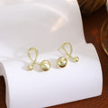 Elegant Gold Brushed Alloy Cross Loop Double Ball Minimalist Stud Earrings view 4