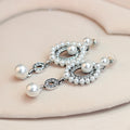 Silver Tone Pearl Oval Halo Crystal Pearl Look Two Designs Metal Dangle Earrings view 5