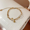 Light Luxury Adjustable Bracelet With Pale Yellow Rutilated Quartz And White Crystal Round Lotus Pod Design view 3