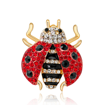 Front product view of the ladybug brooch pin in red and gold