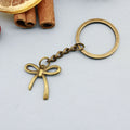 Zinc Alloy Geometric Bow Keychain Bag Charm Gift – Antique Copper view 6