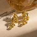 Luxury Gold Alloy Flower Leaf Tassel Drop Stud Earrings For Women Elegant Metallic Statement Earrings view 2