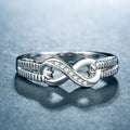 Silver-Tone Infinity Band Ring with Rope Texture and Clear Stones view 2