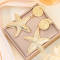 Gold Tone Alloy Spiral Shell And Starfish Drop Dangle Elegant Textured Beach Jewelry Earrings view 4