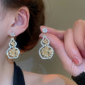 Light Luxury Copper Zircon Flower Hollow Gourd Stud Earrings, New Chinese Geometric Ear Jewelry view 4