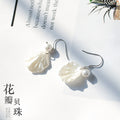 White Shell Flower Drop Earrings With Pearl Centers view 2
