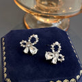 Elegant Hollow Bow Knot Pearl Rhinestone Alloy Studs For Women Light Luxury Sweet Style Earrings view 3