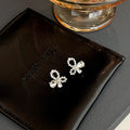 Elegant Hollow Bow Knot Pearl Rhinestone Alloy Studs For Women Light Luxury Sweet Style Earrings view 4