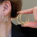 Alloy Irregular Twisted Round Hoop Earrings With Silver Pins European Minimalist Luxury Style view 1