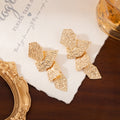 Vintage Exaggerated Gold Leaf Drop Earrings Hollow Butterfly Ginkgo Statement Earrings view 3