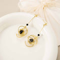 Luxury Alloy Planet Orbit Black Bead Long Drop Stud Earrings For Women Elegant Geometric Pendant Earrings view 2