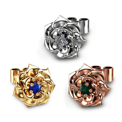 Front product view showing layered metal rose petals, round center stones, and straight stud posts in three finishes