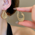 European And American Multi-Layer Hollow Twisted Oval Metal Clip-On Earrings, Vintage Minimalist Luxe Style view 4