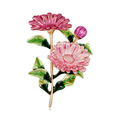 Front product view of the daisy brooch pin in red and green