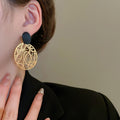Vintage Hollow Metal Round Disc Stud Earrings European American Luxe Geometric Earrings for Women view 3