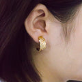 Gold Tone Crystal Leaf Huggie Earrings With Clear Stone Accents view 3