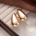 Vintage Luxury Smooth Gold Alloy Teardrop Comma Drop Stud Earrings For Women Runway Statement Earrings view 4