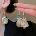 Chic Copper Hollow Petal Pearl Tassel Drop Earrings Geometric Ear Hook Fashion Jewelry view 1
