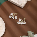 Elegant New Chinese White Enamel Plum Blossom Branch Alloy Flower Stud Drop Light Luxury Earrings view 4